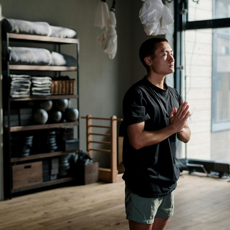 Minimalist yoga studio with wooden floors and sunlight